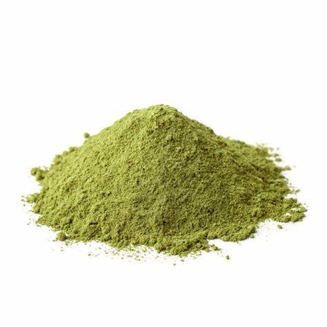 Heap of fine green kratom powder on white.